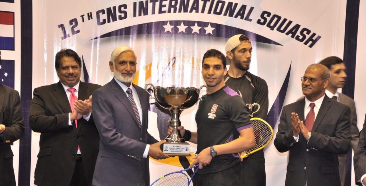 Zahed Mohamed receives his trophy as Jahangir Khan (left) looks on