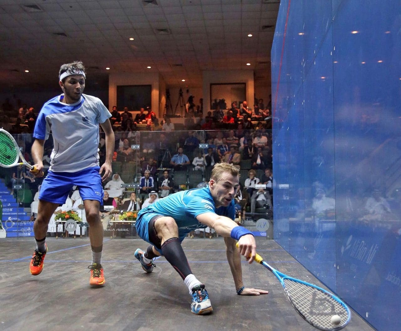 Nick Matthew at full stretch against Mohamed Al Tamimi